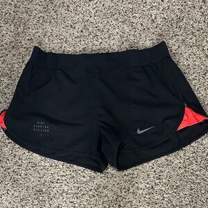 Nike Women's Black and Red Athletic Shorts with adjustable side zipper